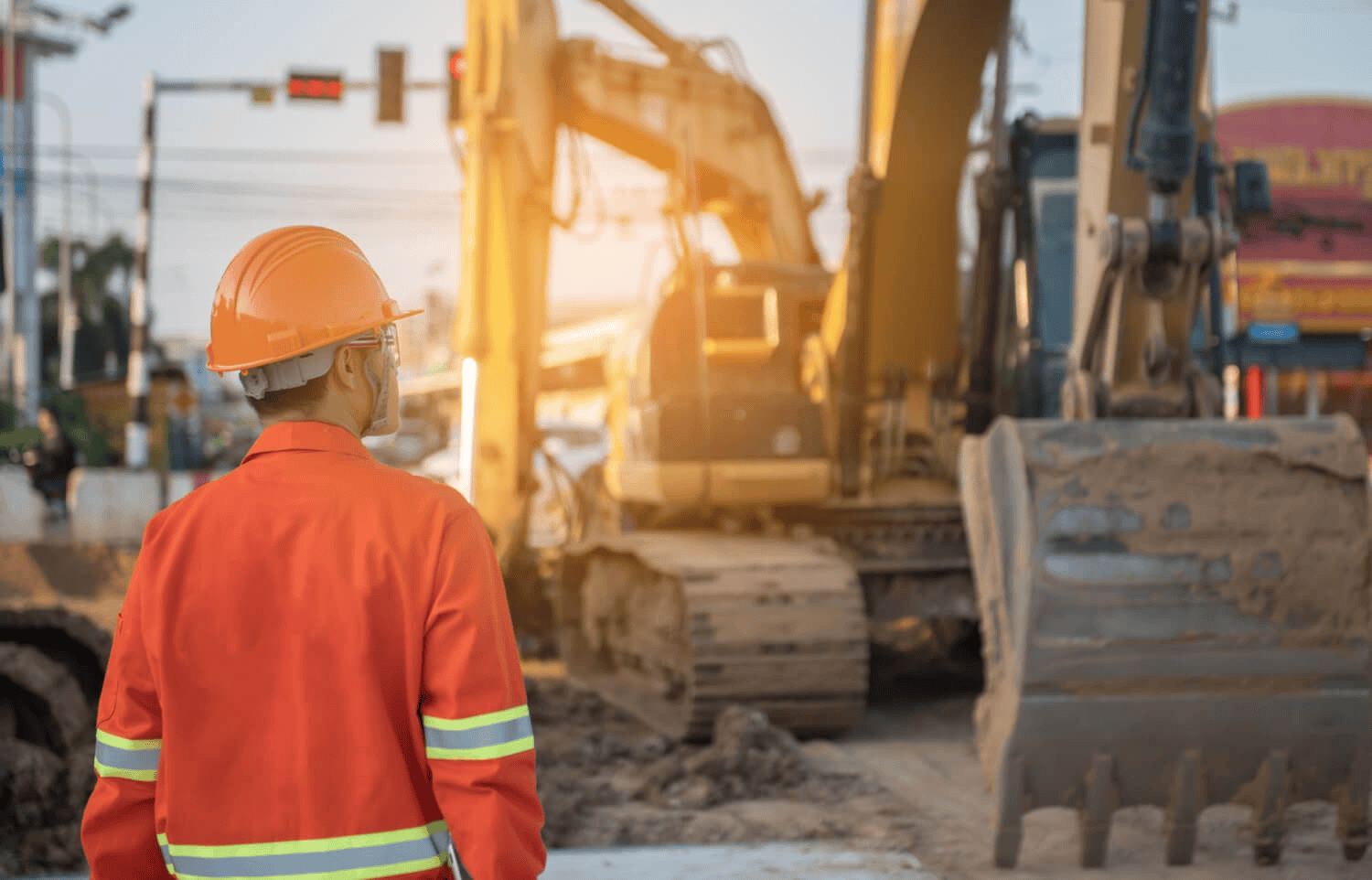 Mining A Man Walking Towards Construction Equipment In Ppe, He Makes Use Of Compliance Management Software.